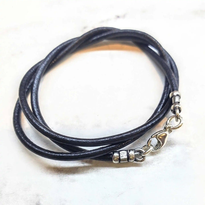 Handmade Various Lengths Smooth Black Leather Necklaces featuring a layered design with silver clasp and accents.