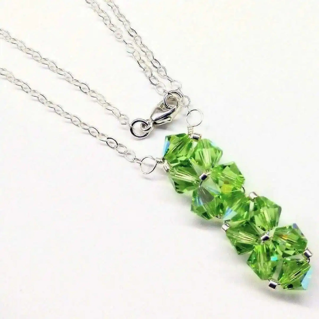 Handmade Wire Colored Woven Crystal Rock Candy Necklace featuring vibrant green Swarovski crystals on a delicate silver chain.
