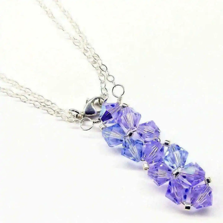 Handmade Wire Colored Woven Crystal Rock Candy Necklace featuring purple Swarovski crystal bicones on a silver chain.