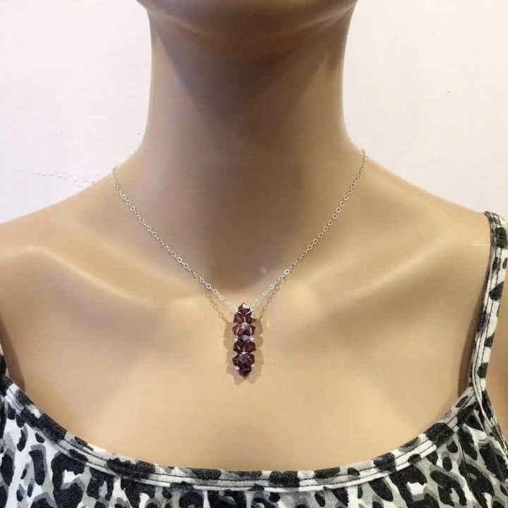 Handmade Wire Colored Woven Crystal Rock Candy Necklace displayed on a mannequin with a vertical crystal bar pendant.