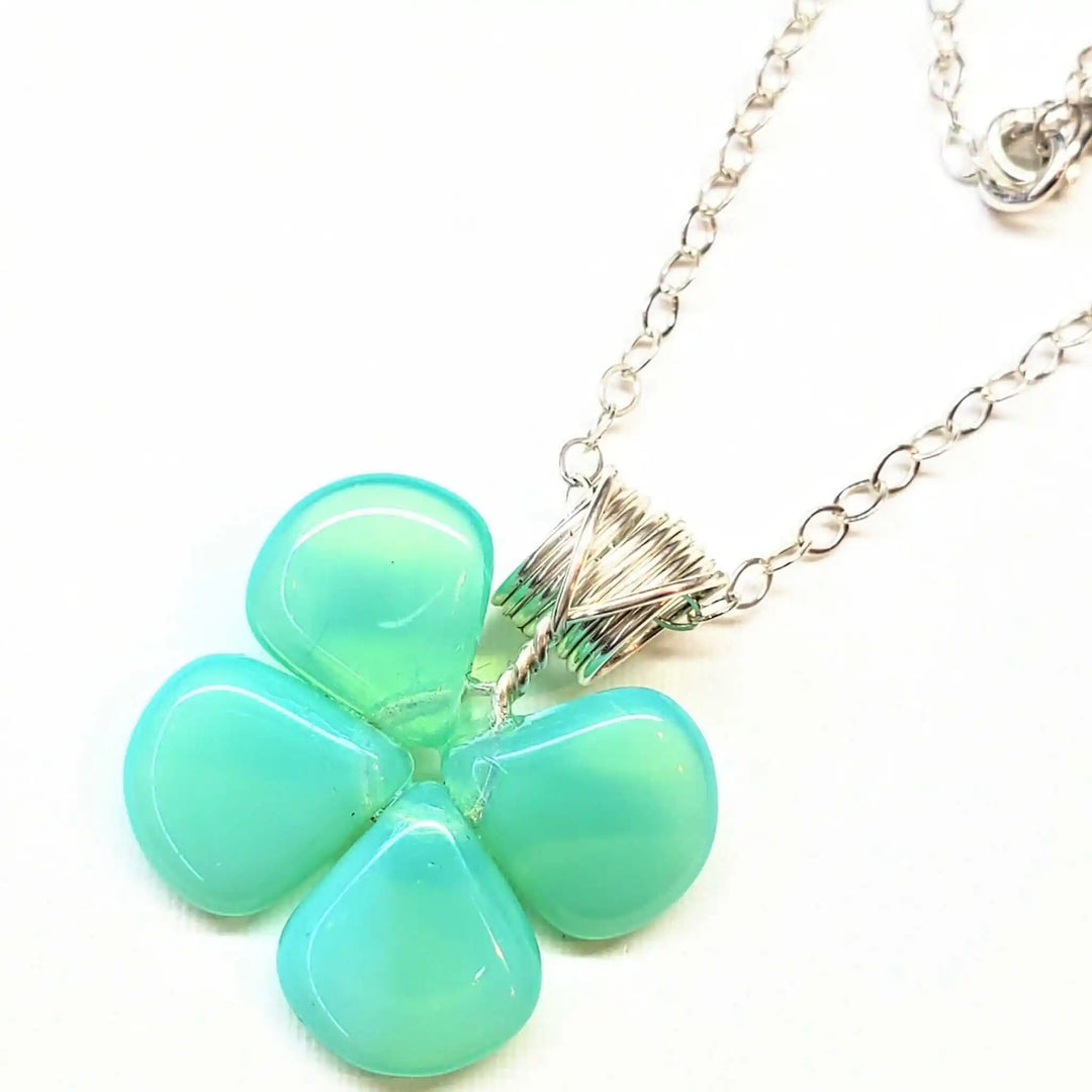 Mint green beaded clover necklace featuring Czech glass beads with a sterling silver chain.