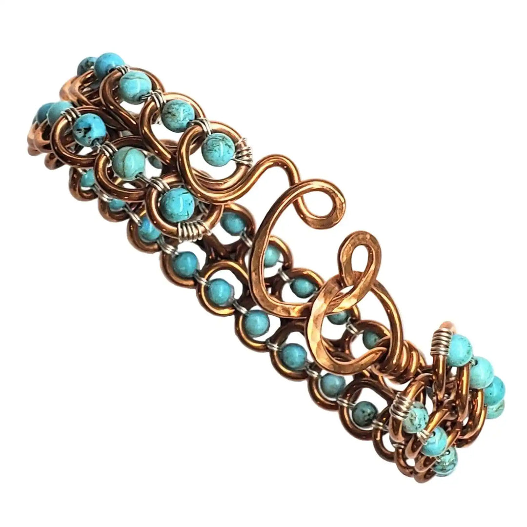 Wire Wrapped Turquoise Copper Infinity Heart Closure Bangle displaying turquoise crystals and elegant heart clasp design.