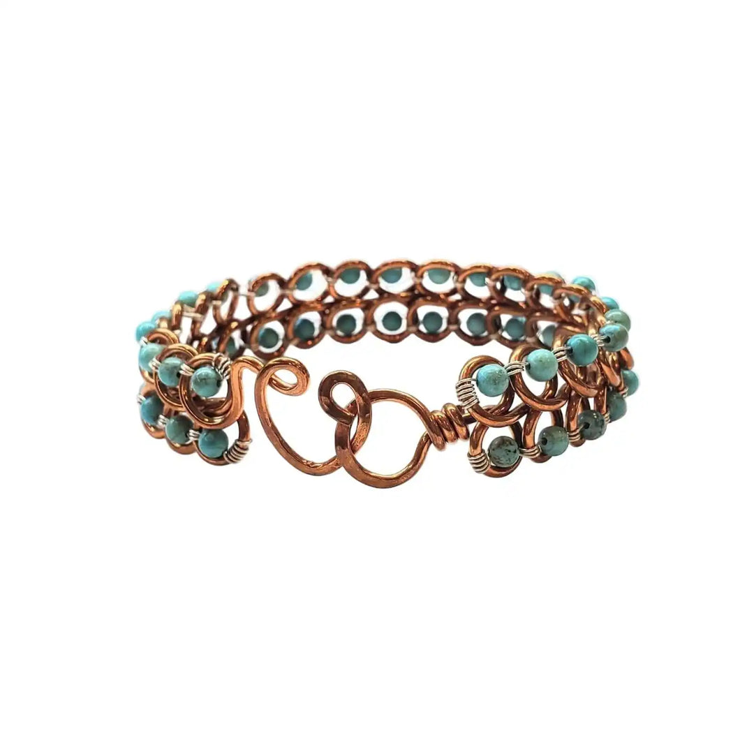 Wire Wrapped Turquoise Copper Infinity Heart Closure Bangle featuring turquoise beads and artistic design.