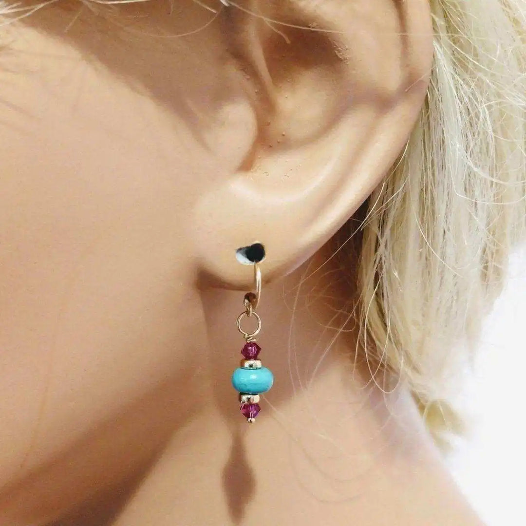 Hot Pink and Turquoise Gemstone14 K Gold Filled Earrings showcased on mannequin ear