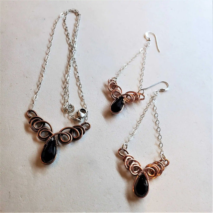 Class 1 Wire Sculpting Earrings Necklace Materials Kit featuring intricate wire designs and black gemstones.