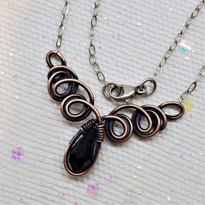 Class 1 Wire Sculpting Earrings Necklace Materials Kit featuring intricate black wire design with pendant.