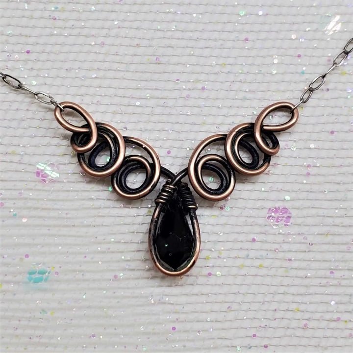 Class 1 Wire Sculpting Earrings Necklace Materials Kit featuring intricate copper and black wire design with crystal drop.