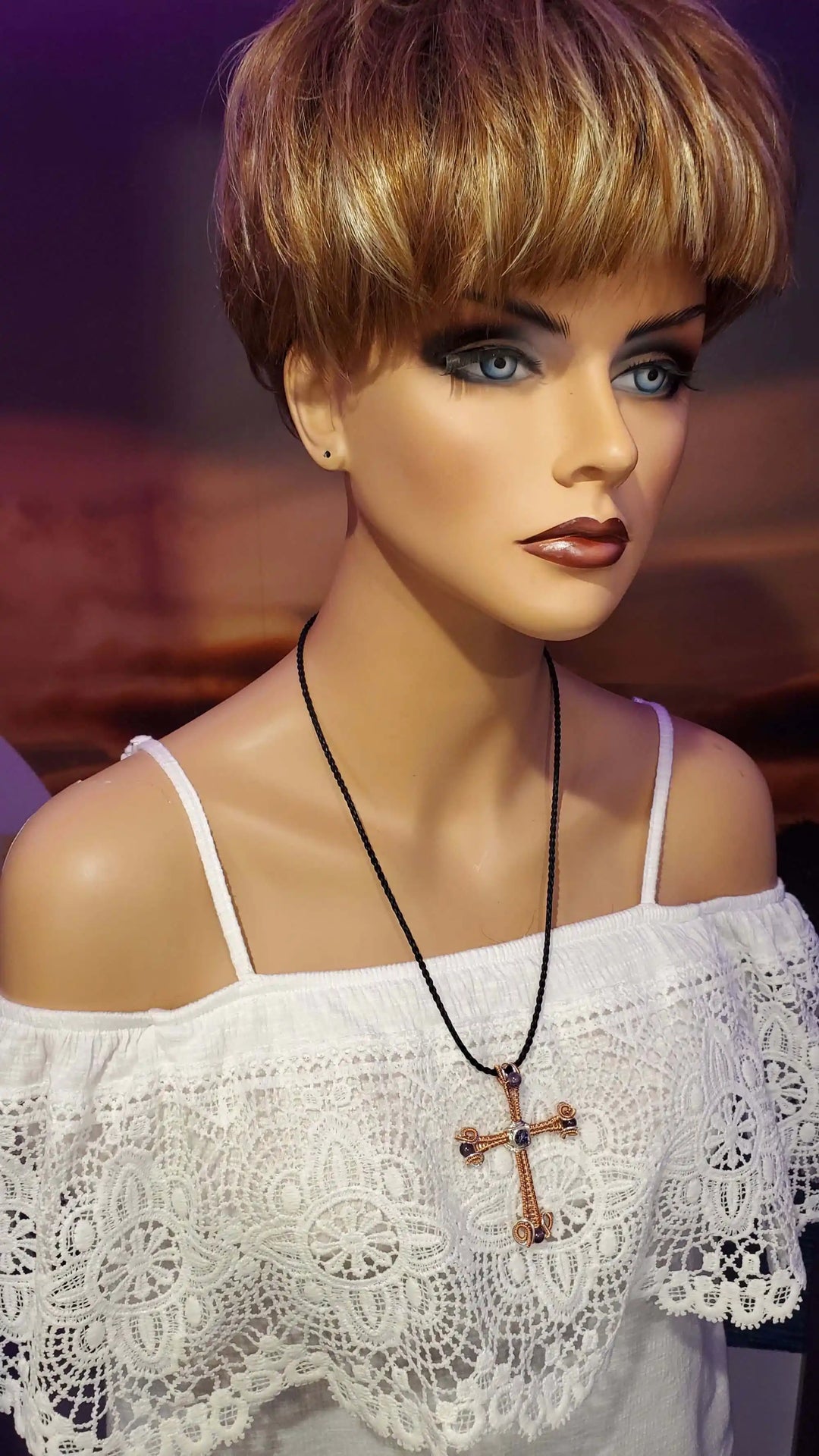 Model wearing a Large Wire Woven Copper Silver Amethyst Cross Necklace showcasing its unique design.