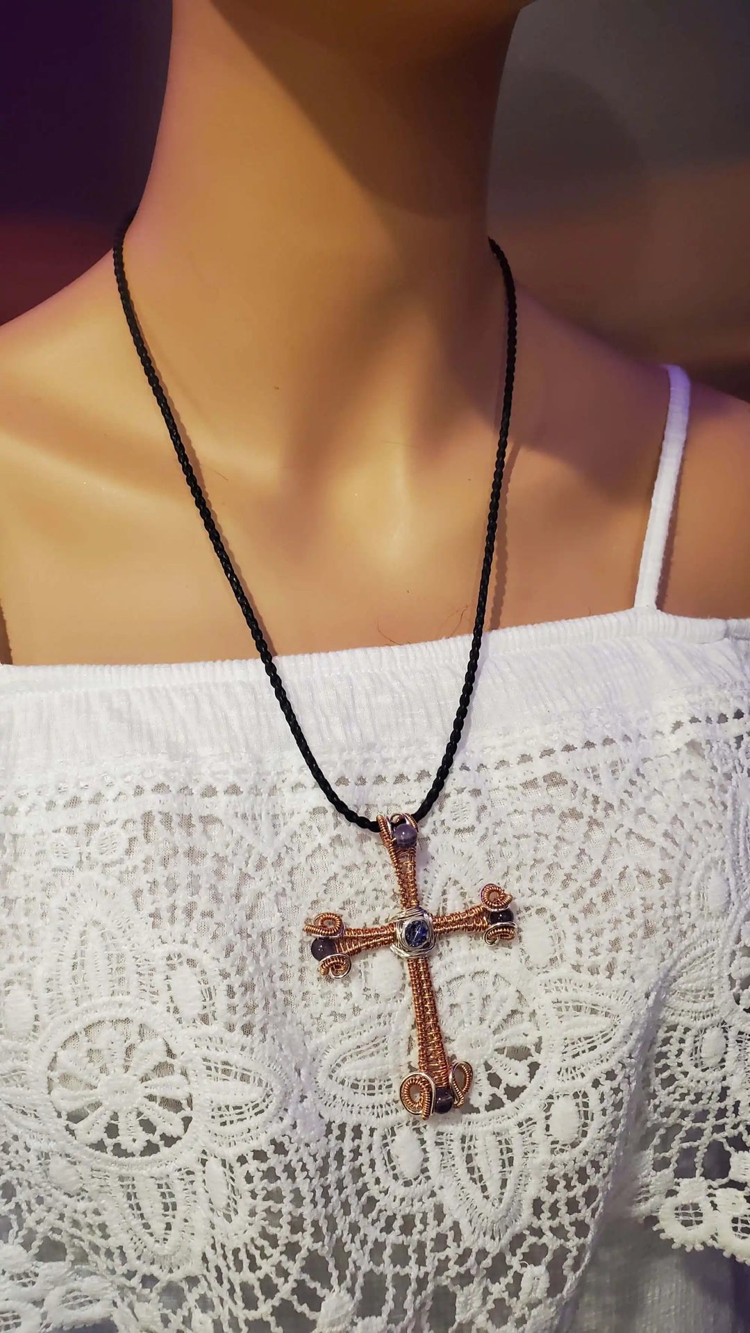 Large Wire Woven Copper Silver Amethyst Cross Necklace displayed on a mannequin with lace top.