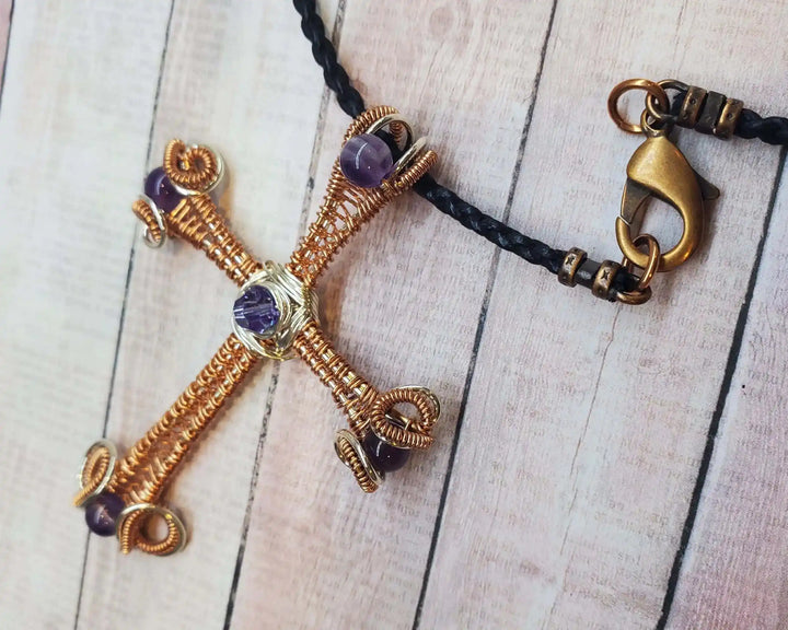 Large Wire Woven Copper Silver Amethyst Cross Necklace on a braided black cord with a clasp, showcasing intricate design.