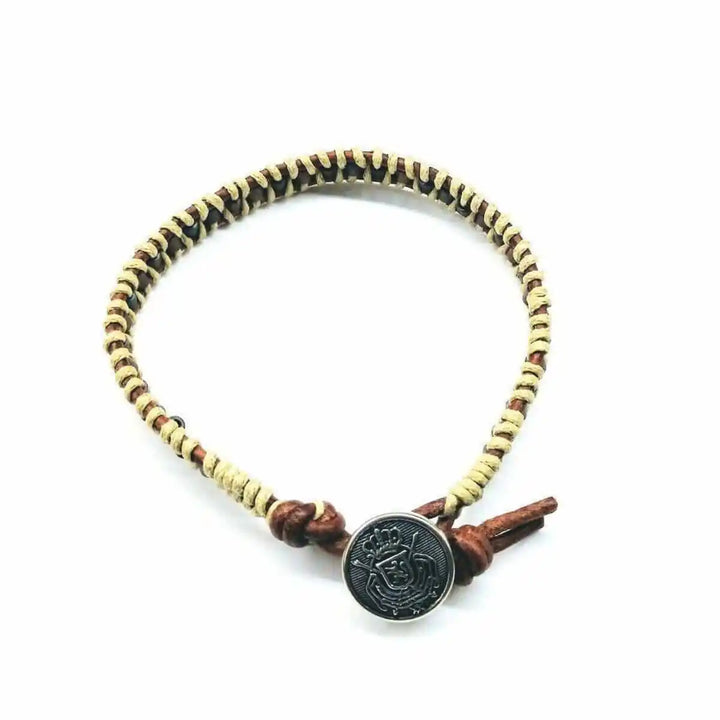 Leather Seed Bead Rattlesnake Tail Weave Bracelet featuring intricate leatherwork and rustic charm.