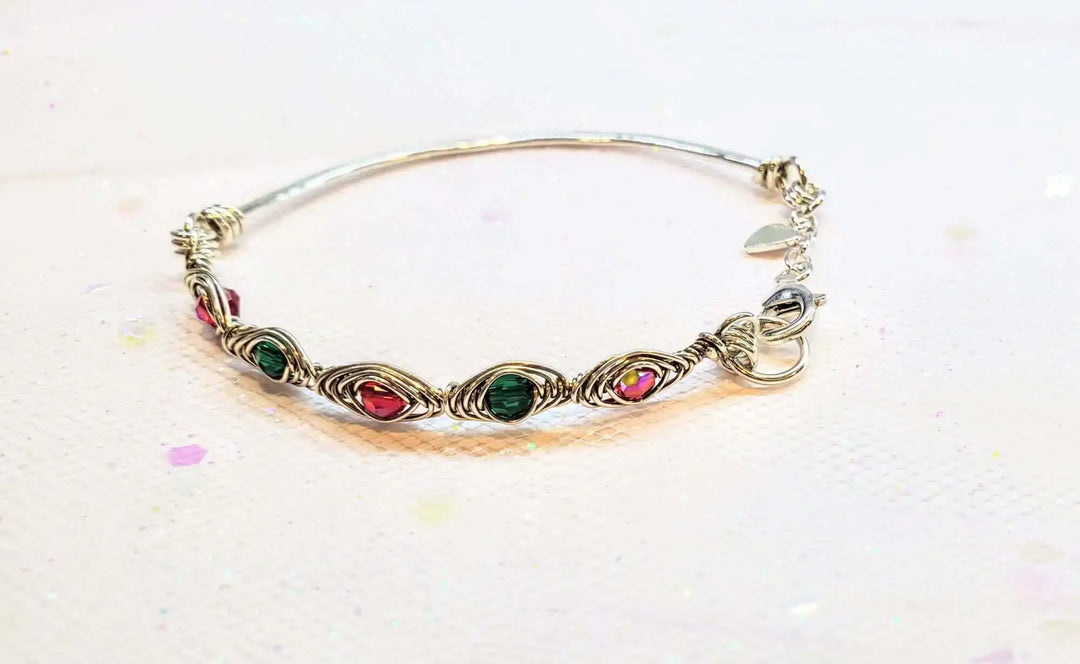 Limited Edition Red Green Christmas Holiday Tube Bracelet showcasing ruby red and emerald green Swarovski crystals in wirework.
