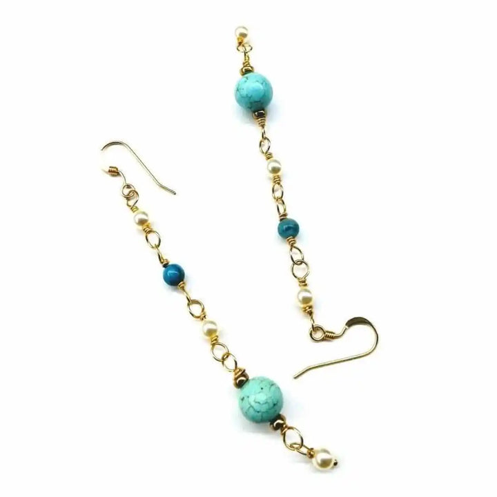 Long 14 K Gold Filled Turquoise Pearl Earrings featuring turquoise and pearl detailing on gold wire.