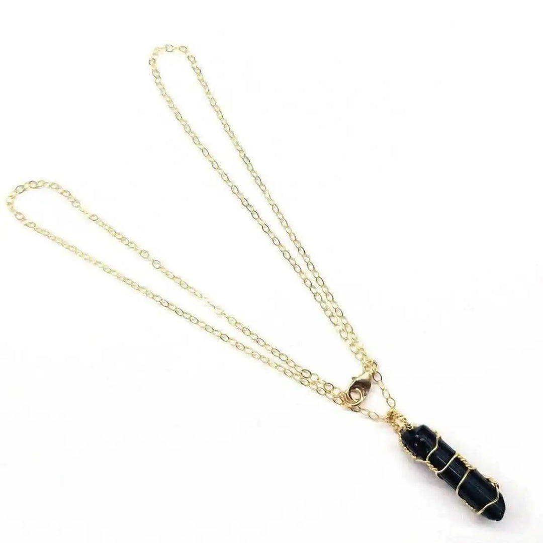 14 K Gold Filled Wire Wrapped Raw Black Tourmaline Necklace with a delicate gold chain.