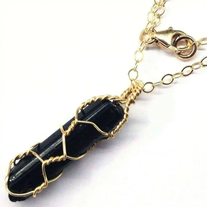 14 K Gold Filled Wire Wrapped Raw Black Tourmaline Necklace showcasing unique design and craftsmanship.