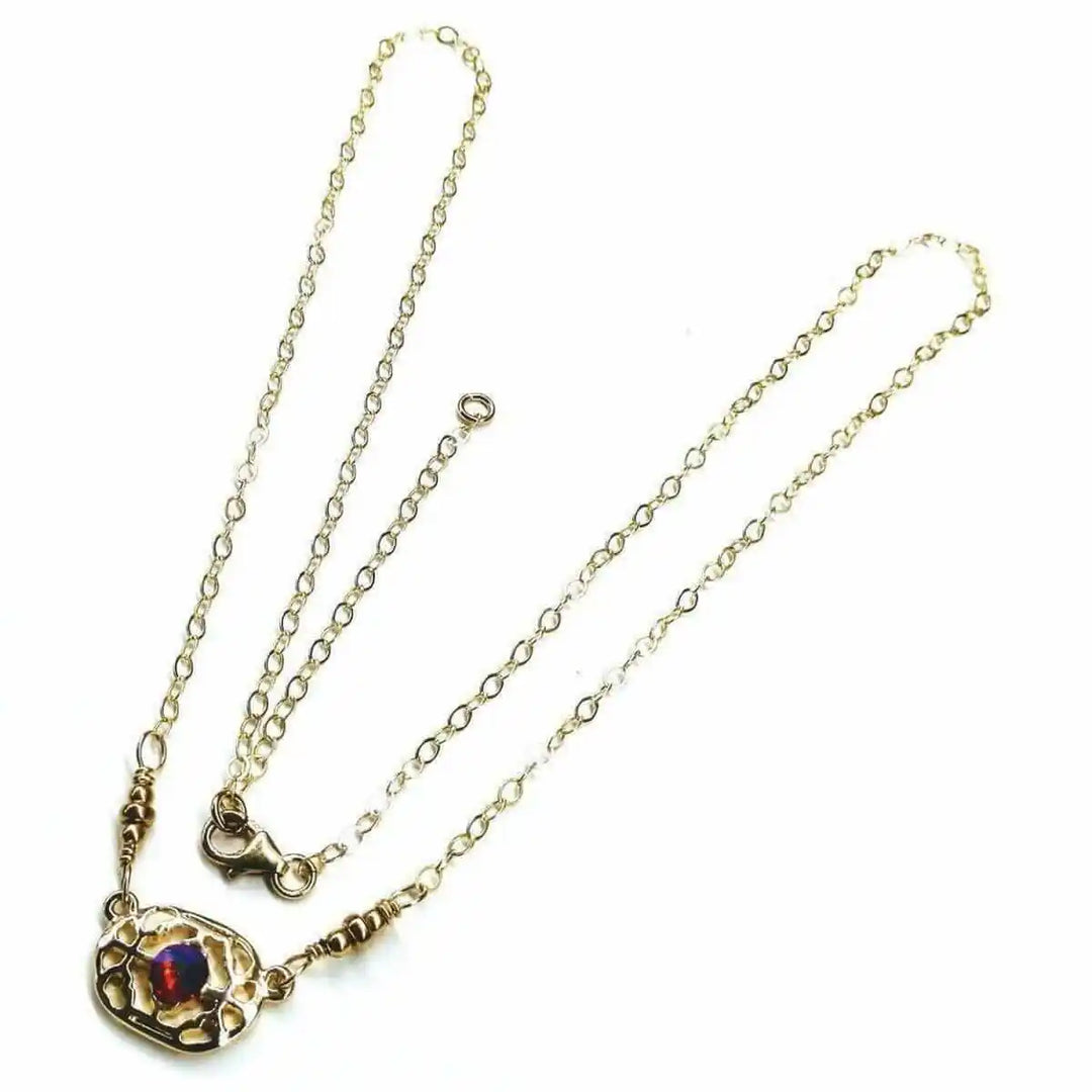 Red Crystal 14 K Gold Filled Adjustable Filigree Choker featuring a stunning red Swarovski crystal and delicate filigree design.