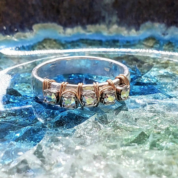 Rose Gold Filled Wire Wrapped Sparkly Crystal Bling Ring on blue and green textured background