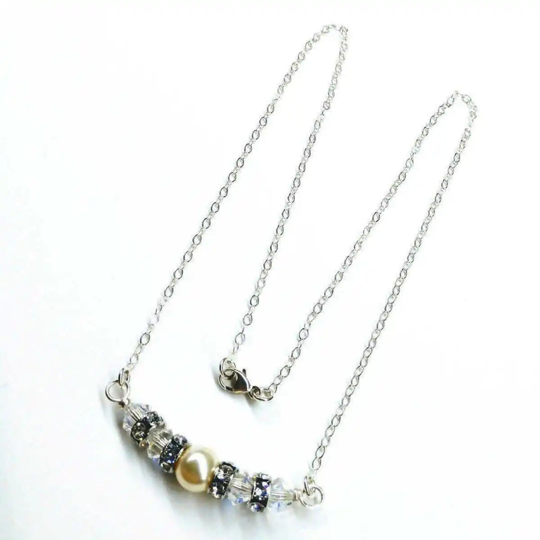 Silver Swarovski Crystal Pearl Bar Bridal Necklace showcasing elegant design and sparkling crystals, perfect for brides.