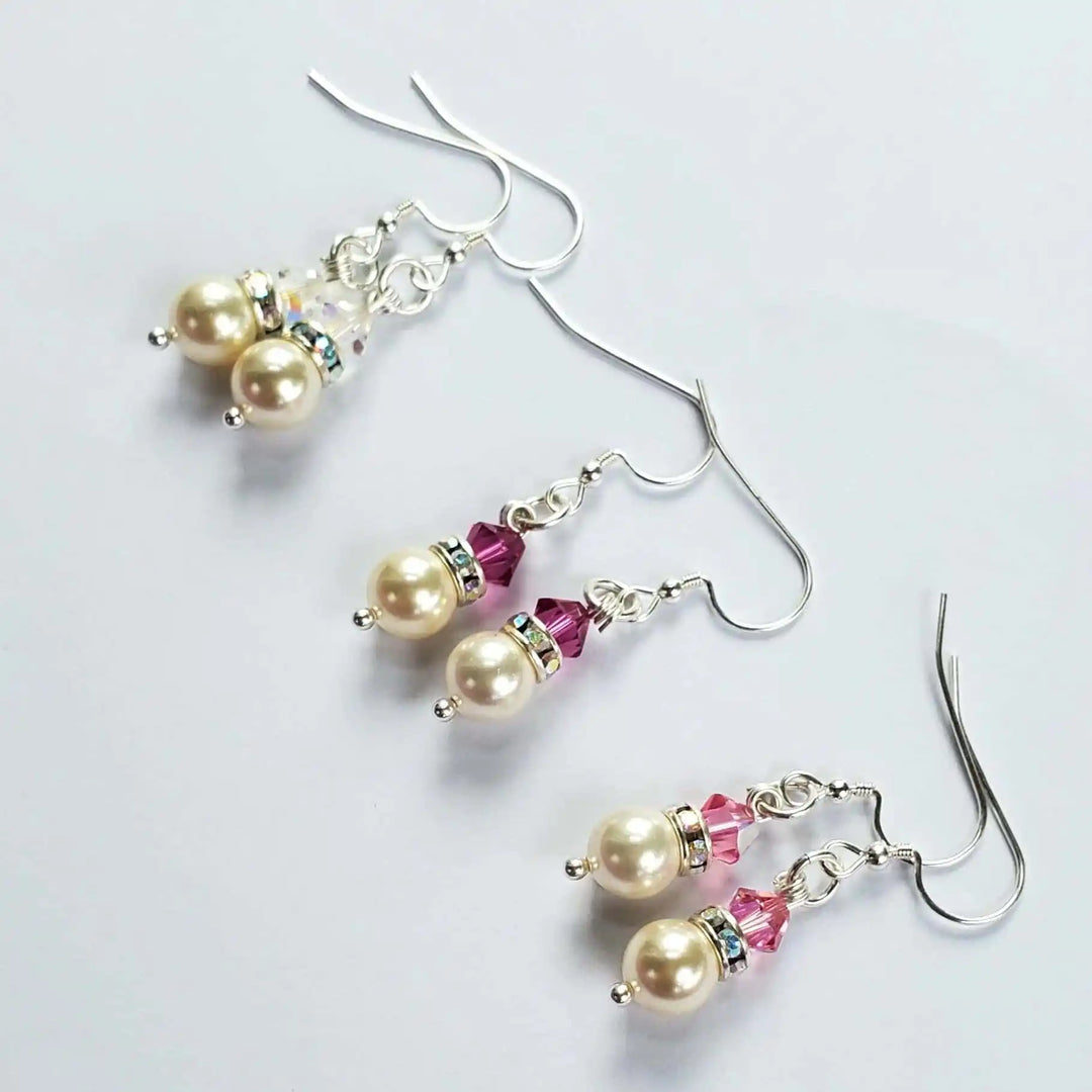 Various Color Swarovski Crystal Pearl Stack Earrings featuring pink crystals and elegant pearls on silver hooks.