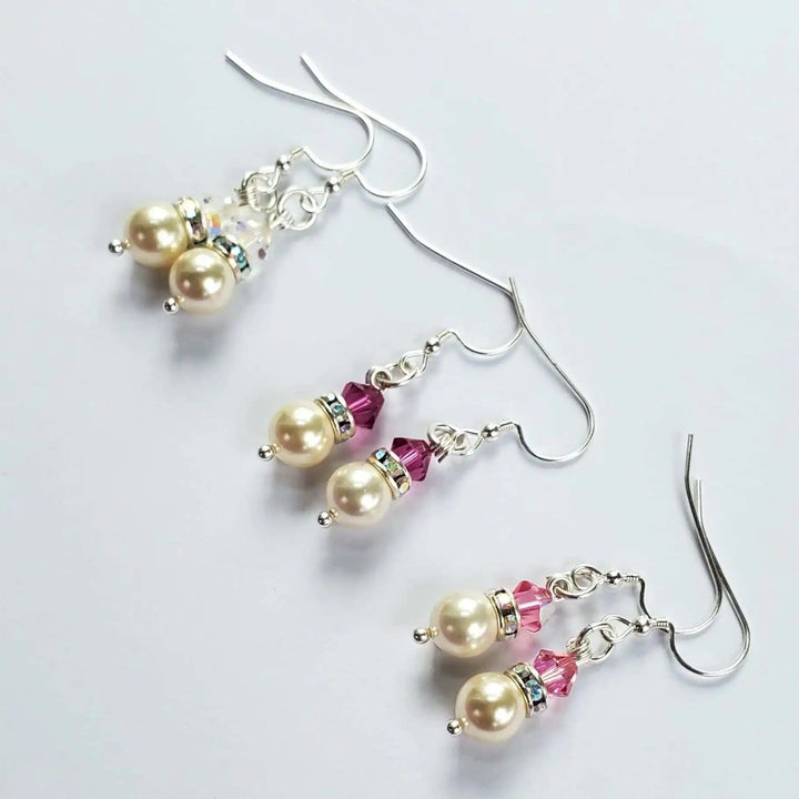 Various Color Swarovski Crystal Pearl Stack Earrings featuring pink crystals and elegant pearls on silver hooks.
