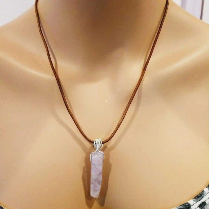 Silver Wrapped Light Amethyst Point Gemstone Necklace displayed on a mannequin featuring a light purple amethyst crystal pendant.
