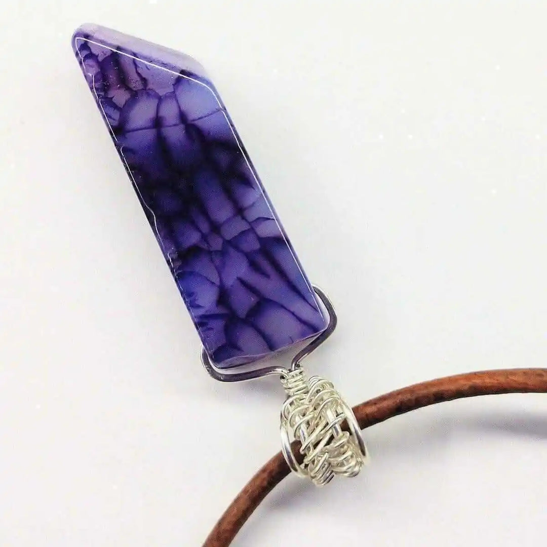Silver Wrapped Purple Dyed Crackle Agate Point Necklace featuring a striking purple agate crystal pendant