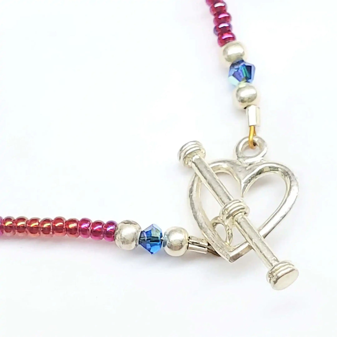 Handmade beaded Swarovski crystal zig zag bib choker necklace featuring intricate beadwork and a heart clasp.
