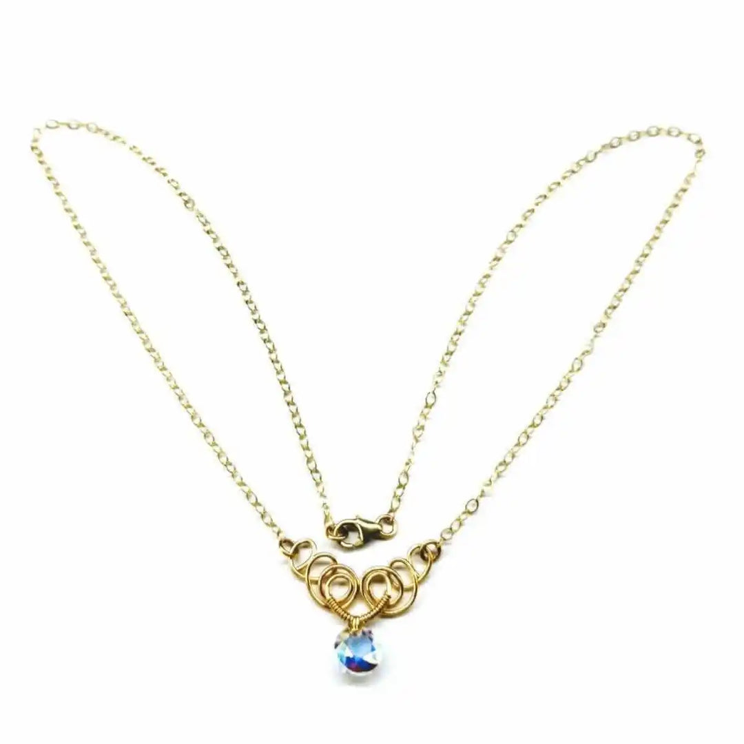 Sparkly Crystal AB Wire Sculpted 14 KT Gold Filled Necklace with gold chain and crystal pendant.