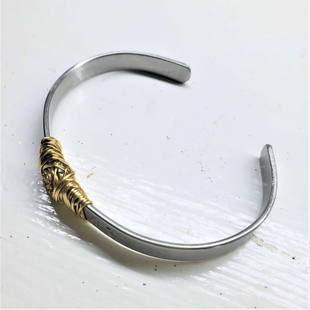 Stainless Steel LOVE Stamped Wire Wrapped Gold Druzy Cuff showcasing elegant wire wrapping design.