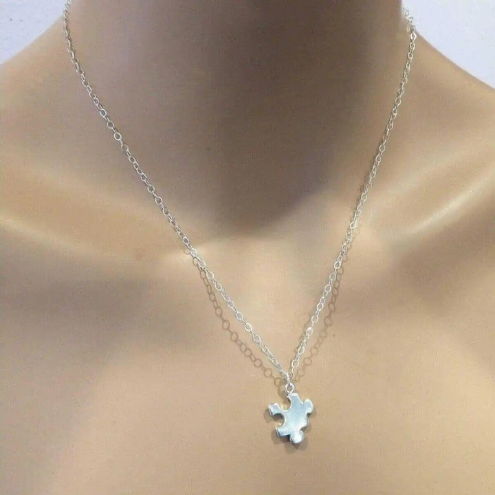 Sterling Silver Autism Awareness Puzzle Piece Chain Necklace displayed on a mannequin&