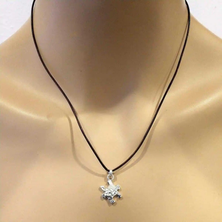 925 Silver Autism Awareness Puzzle Piece Leather Necklace on display mannequin