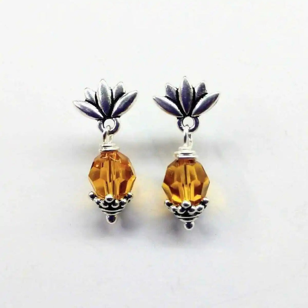 Silver Crystal Pineapple Steel Studded Earrings with topaz gemstone and floral accents.