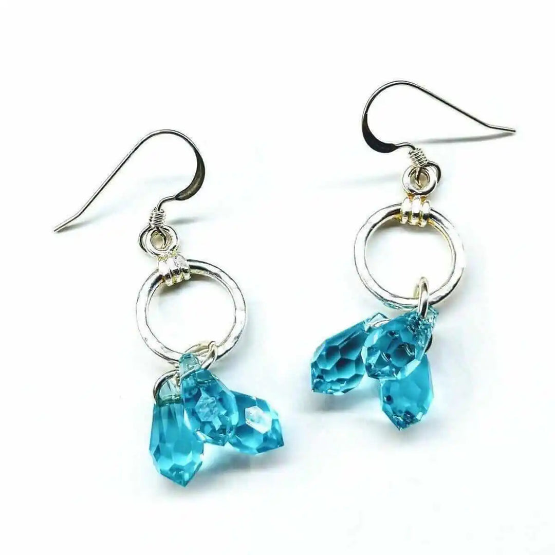 925 Silver Hammered Aqua Crystal Cascading Drop Earrings with aqua Swarovski crystals and silver circles.