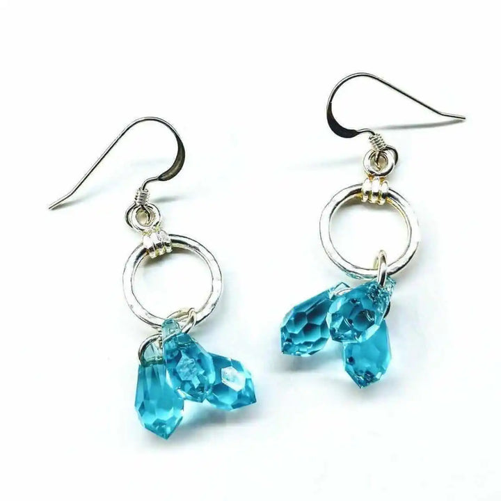 925 Silver Hammered Aqua Crystal Cascading Drop Earrings with aqua Swarovski crystals and silver circles.
