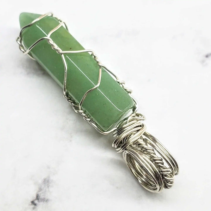 Sterling Silver Messy Wire Wrap Gemstone Crystal Pendant featuring a green crystal with intricate wire wrapping.