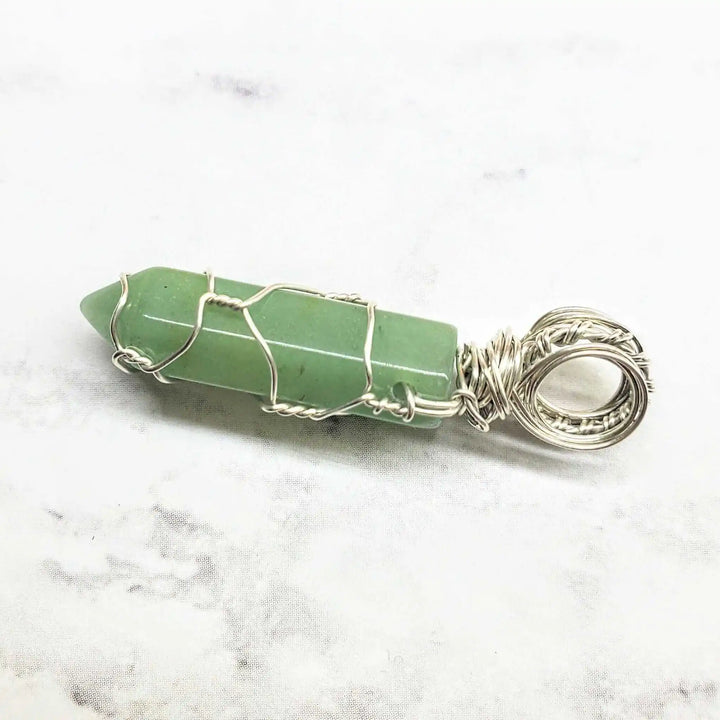 Sterling Silver Messy Wire Wrap Gemstone Crystal Pendant featuring a beautiful green gemstone in intricate wire wrapping.