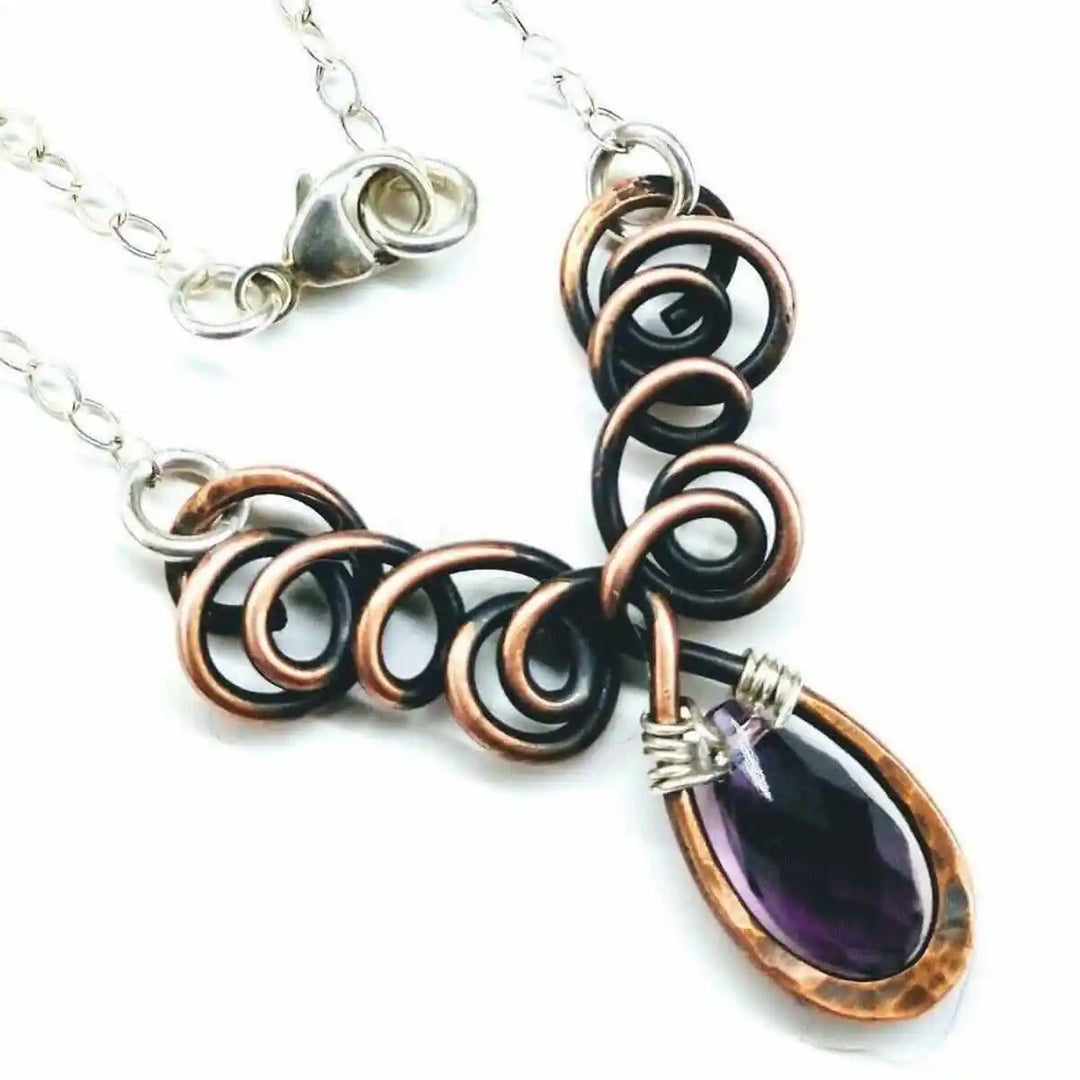 Silver and Copper Wire Sculpted Purple Crystal Drop Necklace showcasing artisan craftsmanship and a stunning amethyst stone.