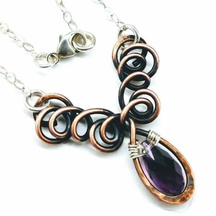 Silver and Copper Wire Sculpted Purple Crystal Drop Necklace showcasing artisan craftsmanship and a stunning amethyst stone.
