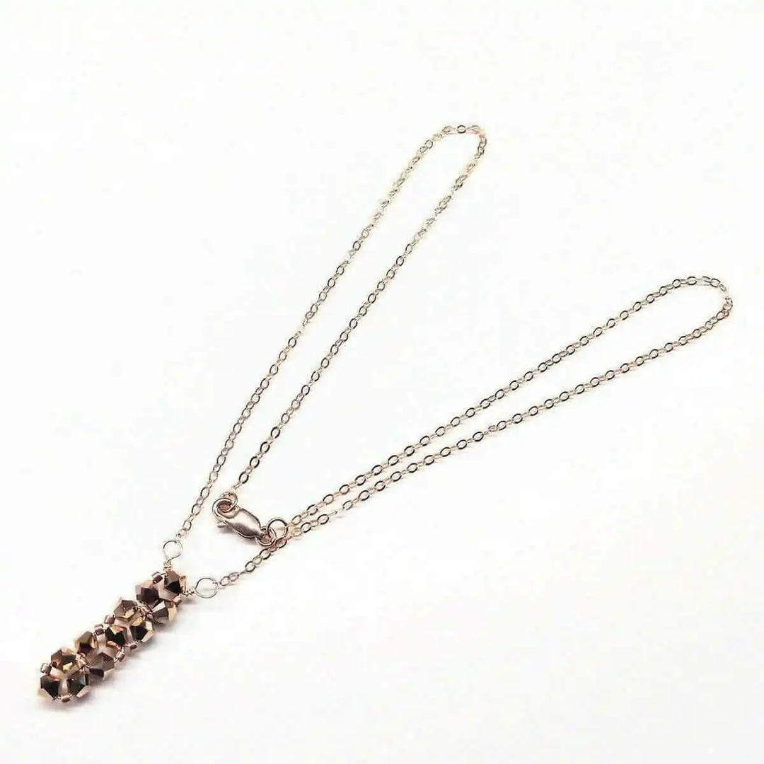 Super Sparkly Rose Gold Rock Candy Crystal Bar Necklace with shimmering Swarovski crystals on a delicate chain.