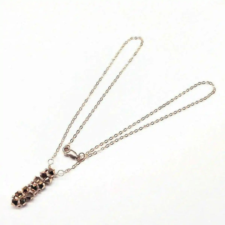 Super Sparkly Rose Gold Rock Candy Crystal Bar Necklace with shimmering Swarovski crystals on a delicate chain.
