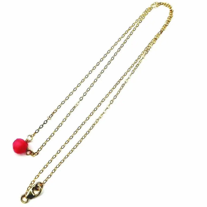 Tiny Hot Pink Chalcedony Gold Filled Necklace with a vibrant pink drop on a gold chain.
