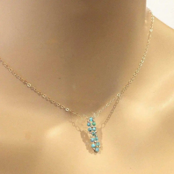Tiny Super Sparkly Rock Candy Crystal Bar Necklace featuring turquoise Swarovski crystals on a delicate chain.