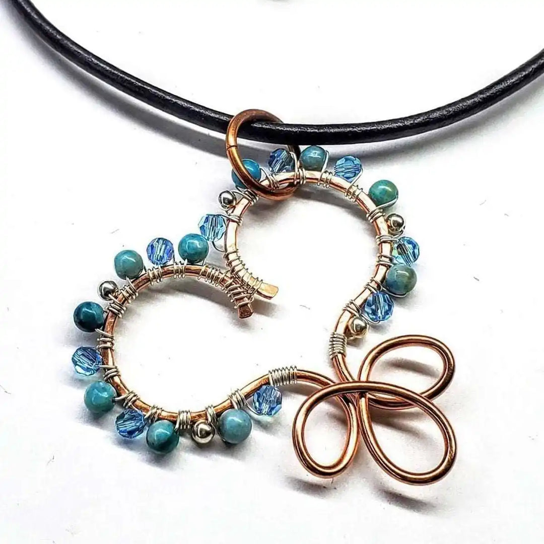 Wire Wrapped Copper Turquoise Heart Infinity Charm Necklace featuring turquoise beads and crystals