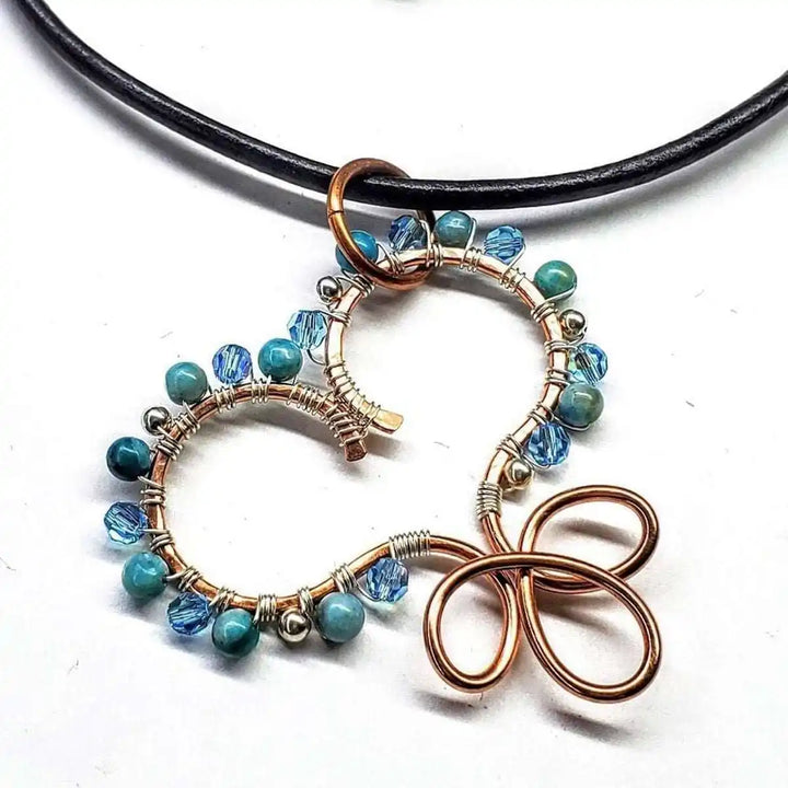 Wire Wrapped Copper Turquoise Heart Infinity Charm Necklace featuring turquoise beads and crystals