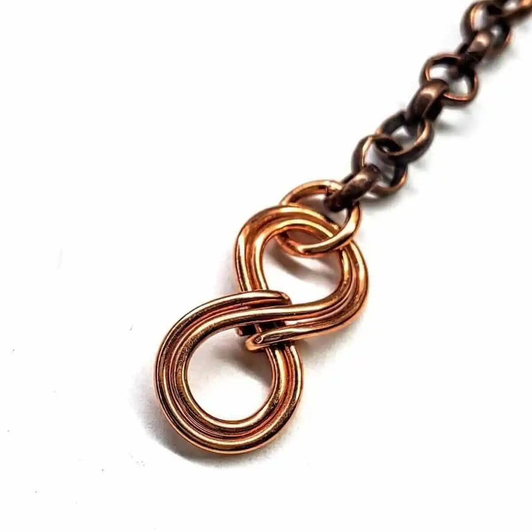 Wire Wrapped Copper Turquoise Heart Infinity Charm Necklace showcasing a copper infinity charm detail.
