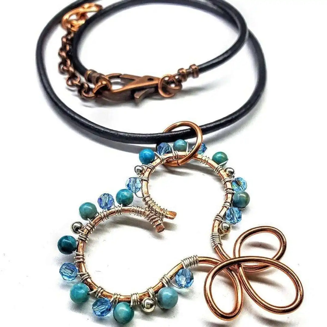 Wire Wrapped Copper Turquoise Heart Infinity Charm Necklace with turquoise beads and Swarovski crystals.