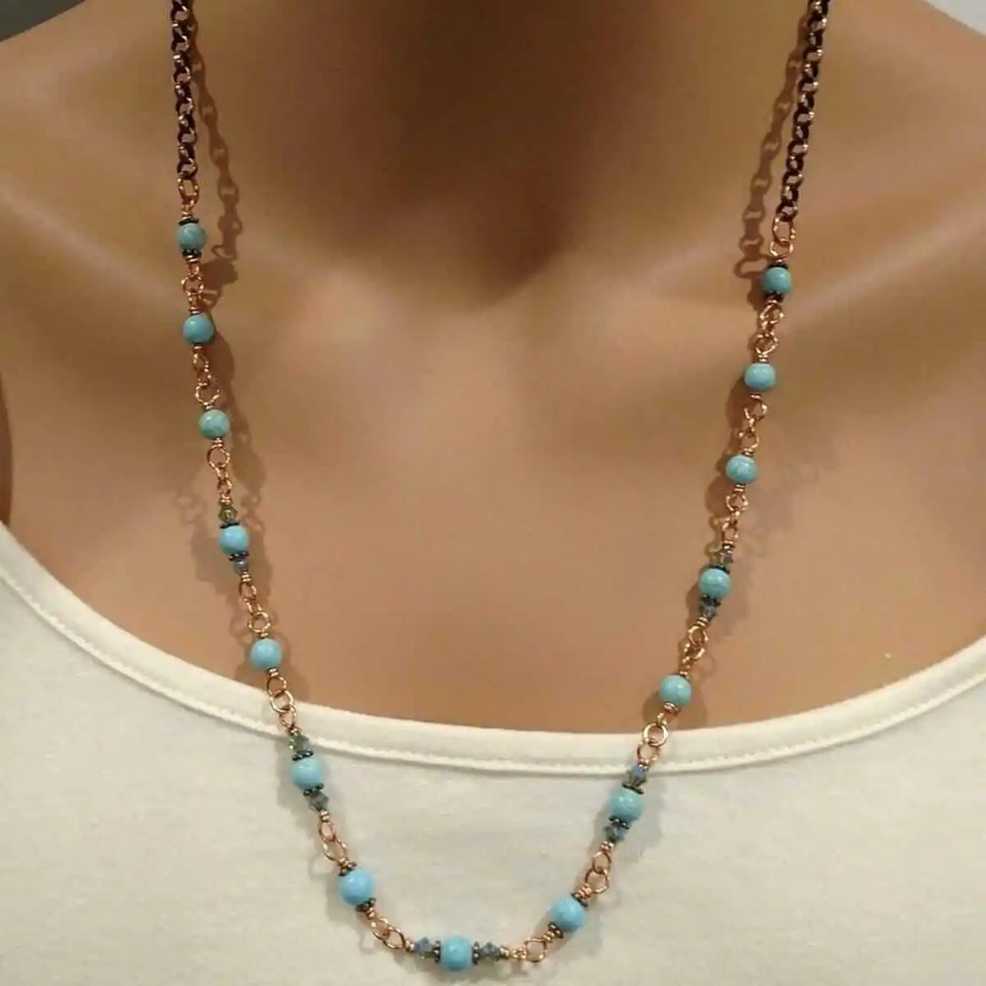 Wire Wrapped 24 Inches Copper Turquoise Necklace displayed on a mannequin, showcasing turquoise gemstones and copper links.