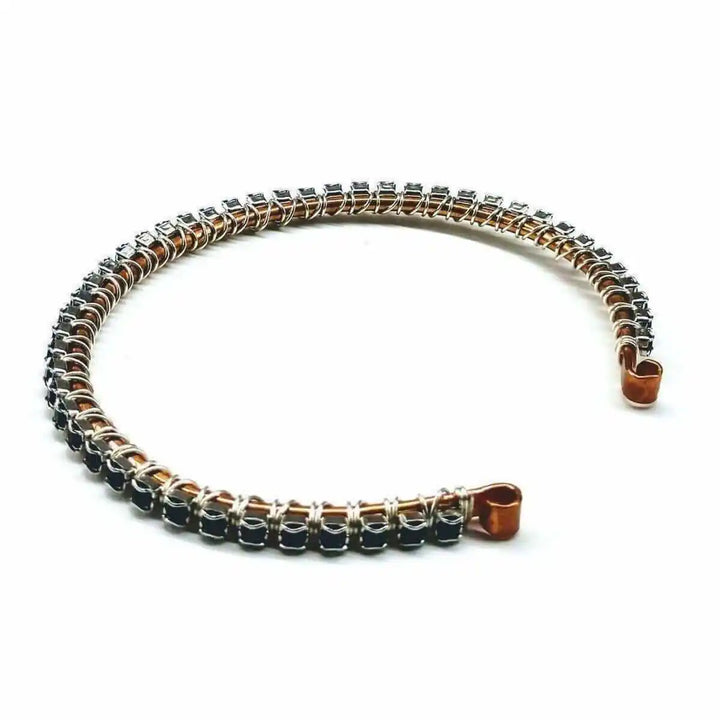 Wire Wrapped Copper Silver Black Crystal Rhinestone Bangle elegantly displayed on a white background.