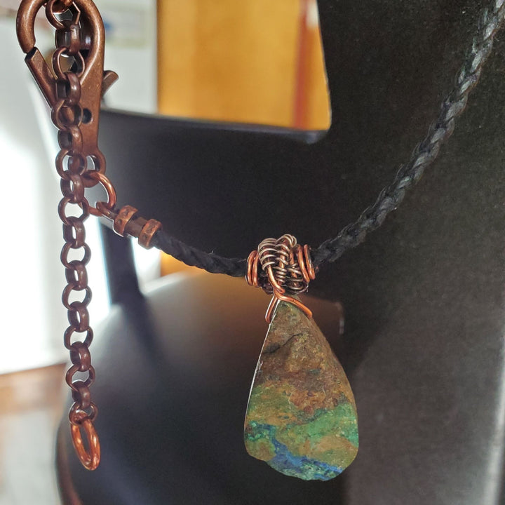 Wire Wrapped Natural Cut Azurite Malachite Drop Necklace hanging from a chair display.