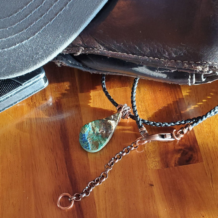 The Wire_Wrapped_Natural_Cut_Azurite_Malachite_Drop_Necklace is among a hat and a wallet in life style pictures